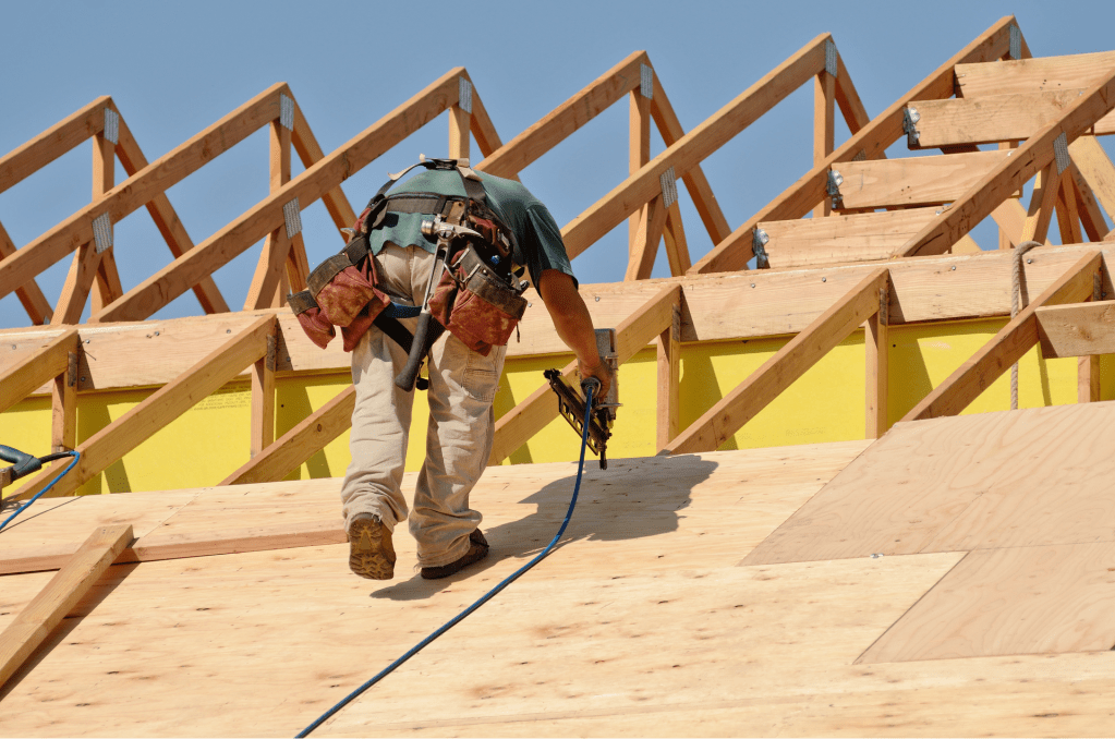guy installing new osb roof deck